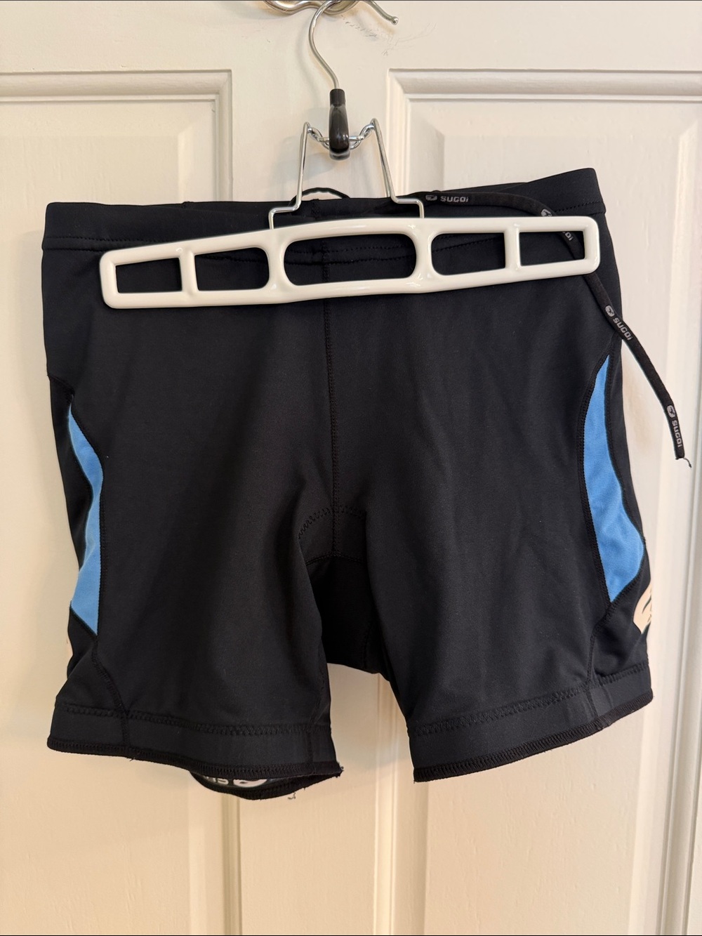 SUGOI Black Bike Shorts with Blue Side Panels